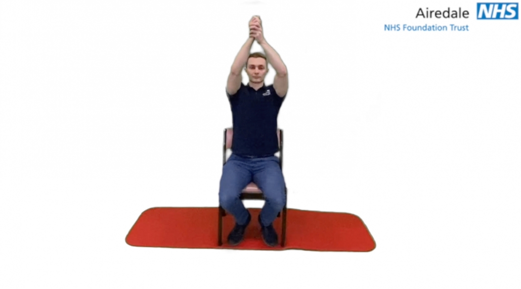 Assisted shoulder flexion seated clasped hands